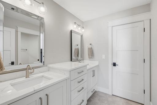 Jack and Jill bathroom with walk-in closets.