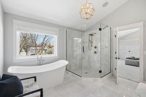 Walk-in tiled shower and soaker tub for a spa like experience.