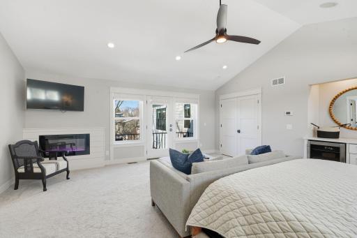 Enjoy a serene fire or step out to the private balcony.