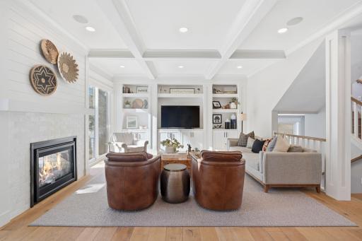 See through gas fireplace with marble surround creates the perfect ambiance.