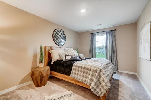 Large upstairs bedroom 2 with walk in closet. Model picture shown. Colors and finishes may vary.