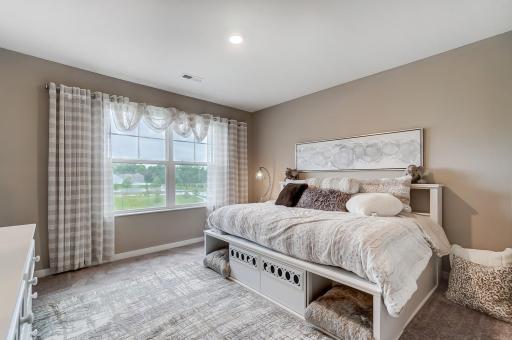 Bedroom 3 with a walk in closet. Model picture shown. Colors and finishes may vary.
