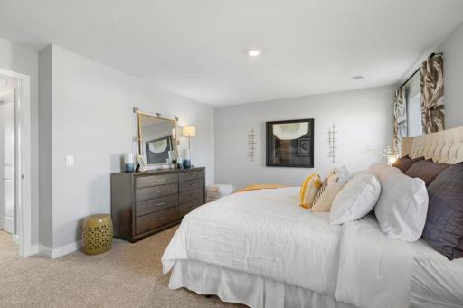 Owner's suite is large enough for a King bed and more. Photo is of Model home. Colors and options may vary. Ask Sales Agent for details.