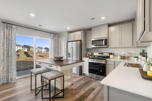 Lots of cabinets and pantry space will ensure that you have plenty of storage options. Photo is of model home. Colors and options may vary. Ask Sales Agent for details.