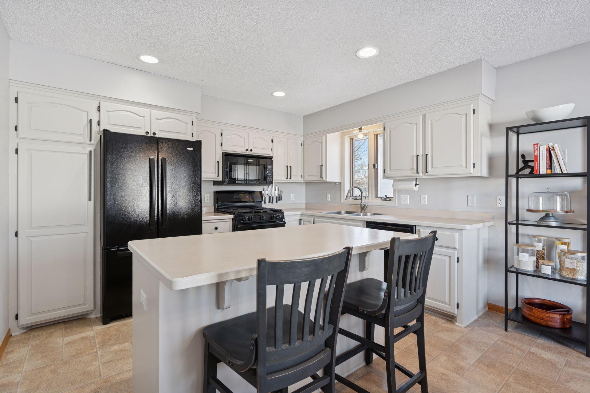 Newly updated kitchen w/ refinished cabinetry, updated hardware and fresh paint.