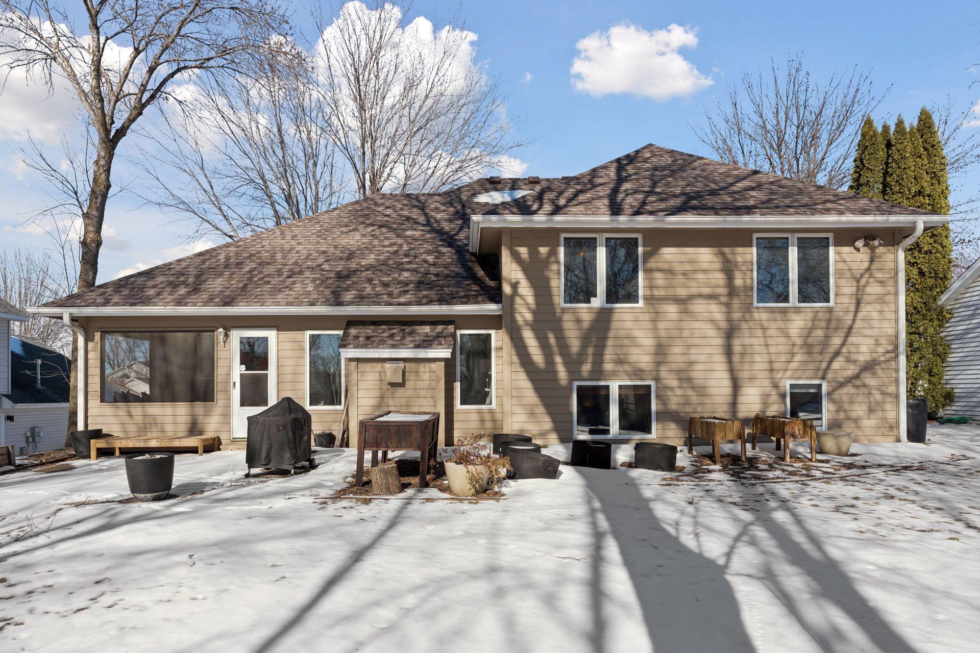 Excellent flat backyard with a great patio and mature trees.