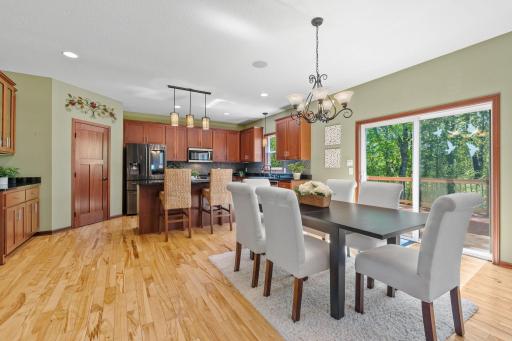 Eat in kitchen and sliding door to the back deck allows for more views of the woods.