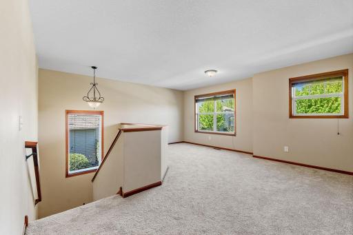 The spacious loft is awash in sunlight and perfect for many uses with new carpet