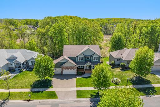 The home is situated with woods directly behind for added privacy and beauty