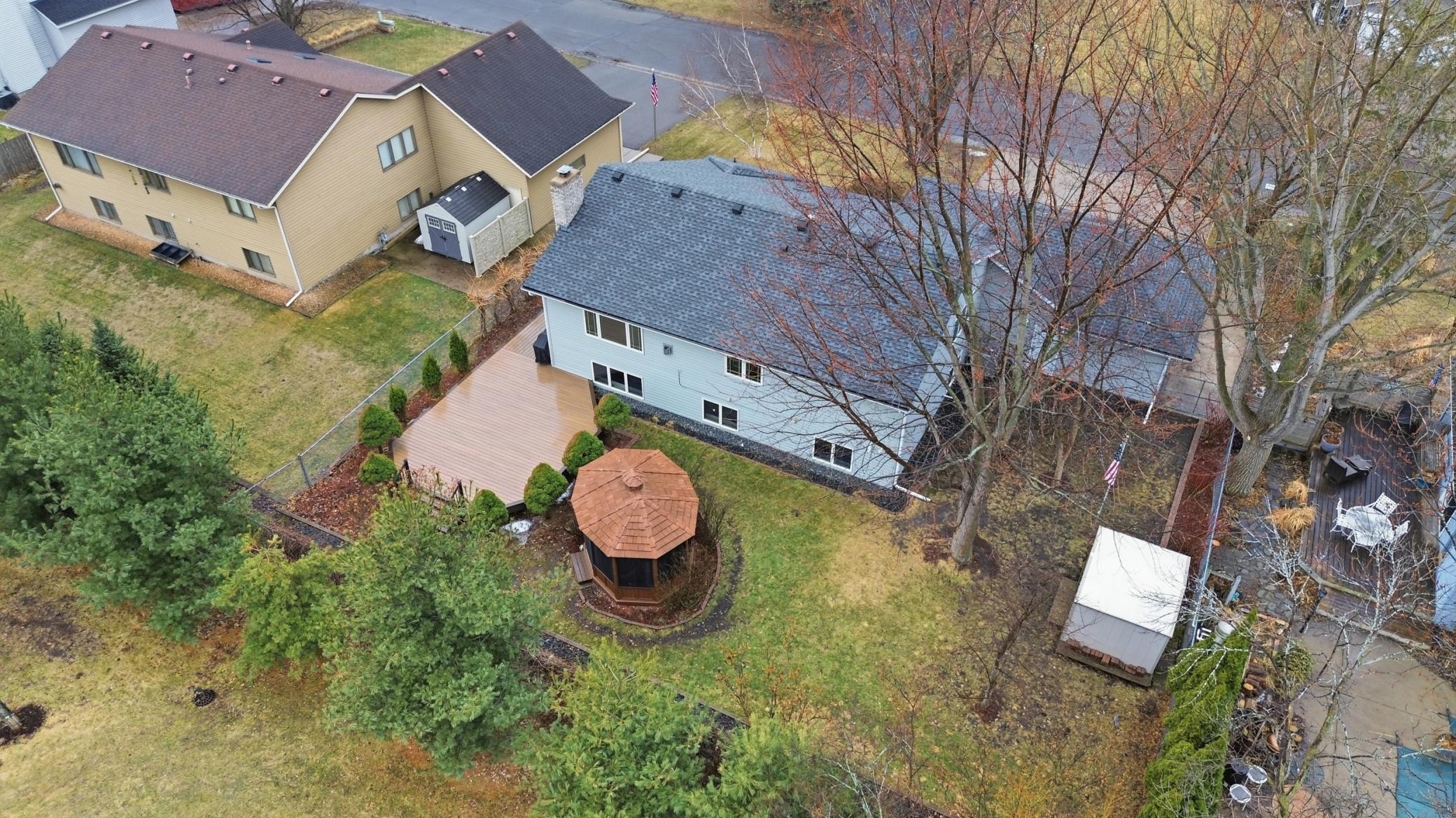 Freshly resurfaced, wrap-around deck extends your living space outdoors, overlooking the generous yard and charming gazebo for endless outdoor enjoyment.
