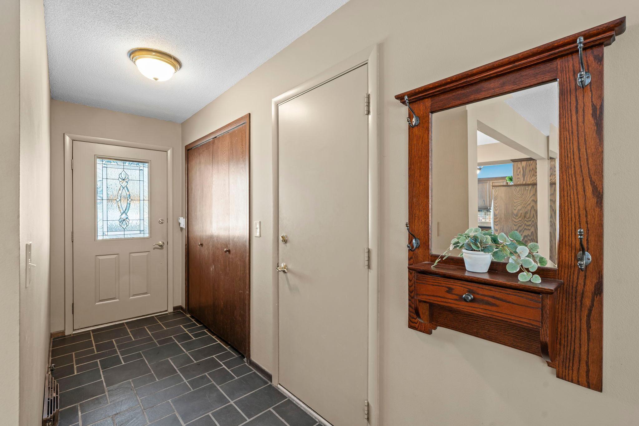 Slate tiled foyer welcomes you and your guests.