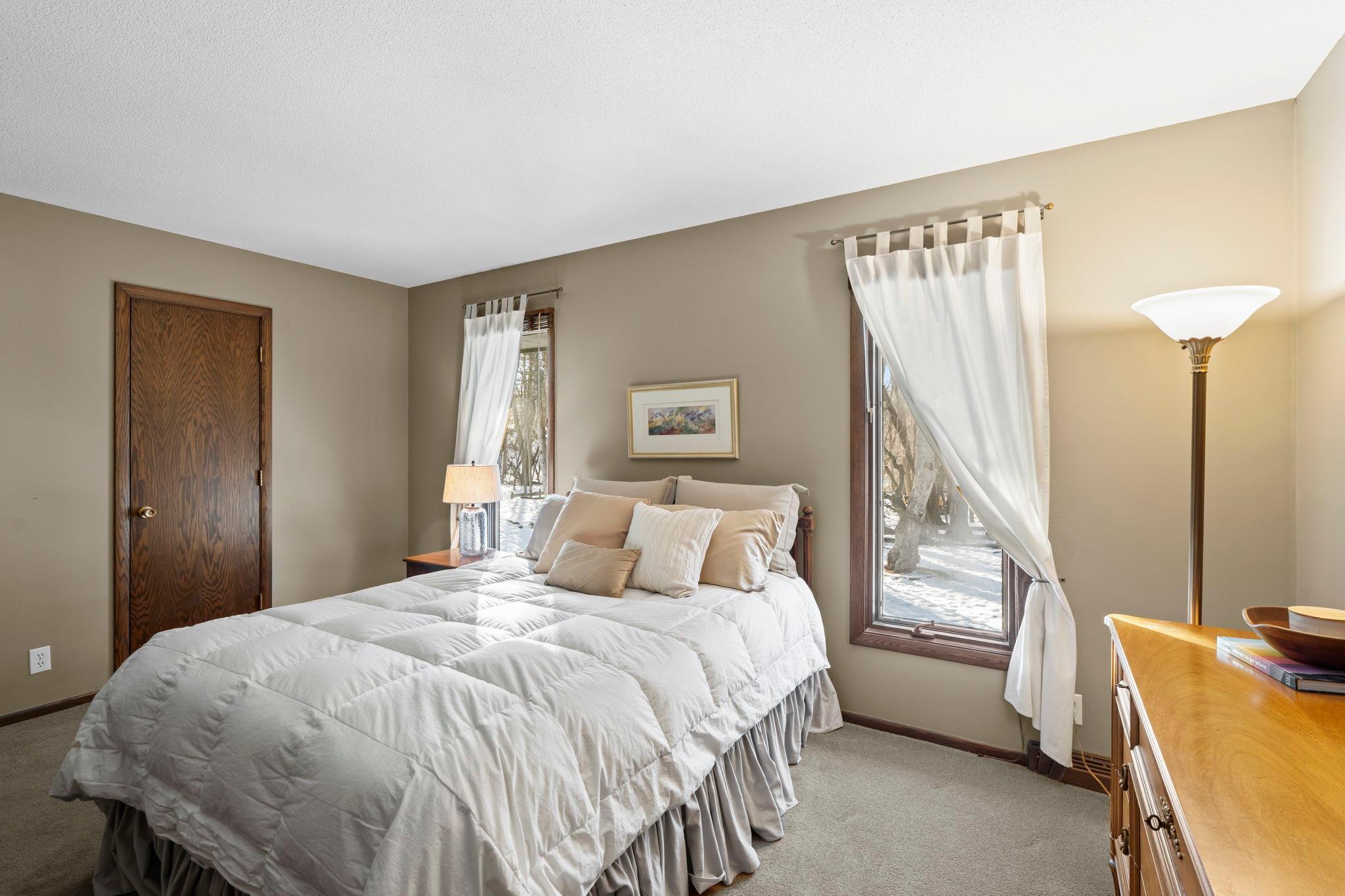 Double large windows in the primary bedroom bring in a ton of natural light.