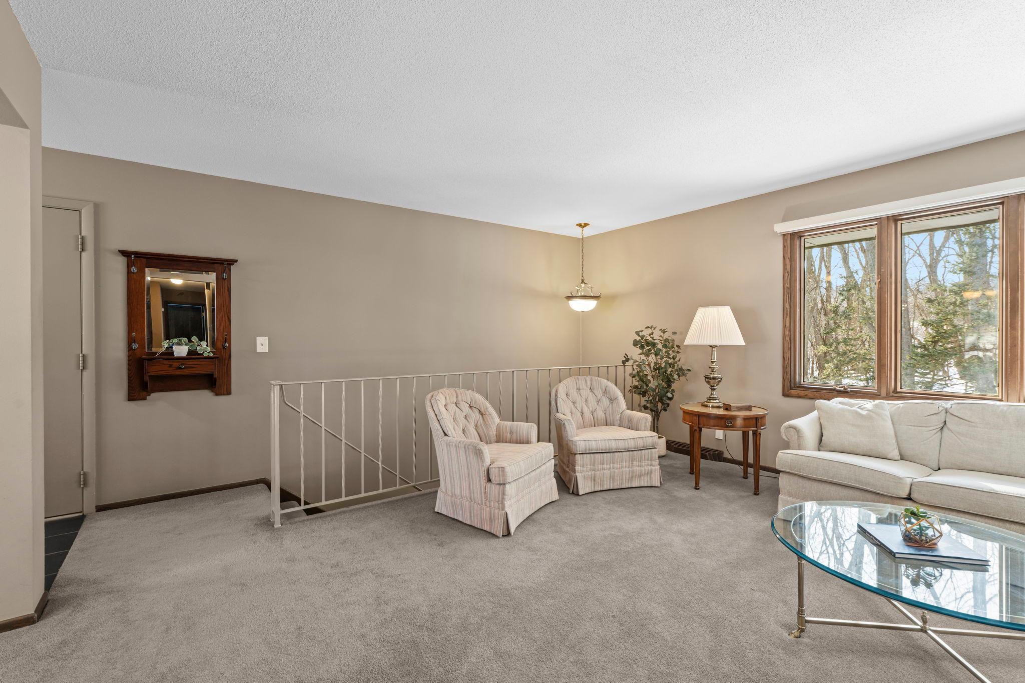 Neutral carpeting and paint throughout. Move-in ready! Open staircase to the lower level.