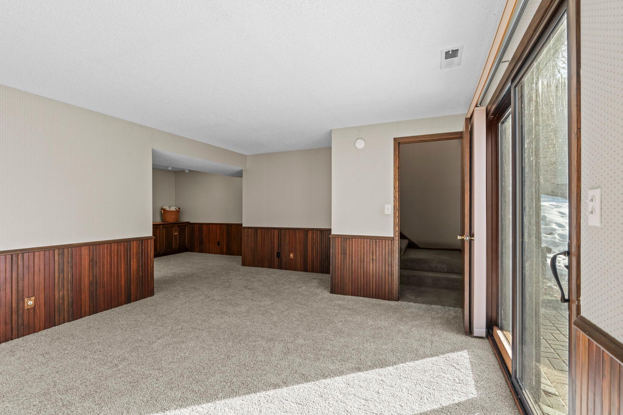 Brand new carpeting spans the lower level.