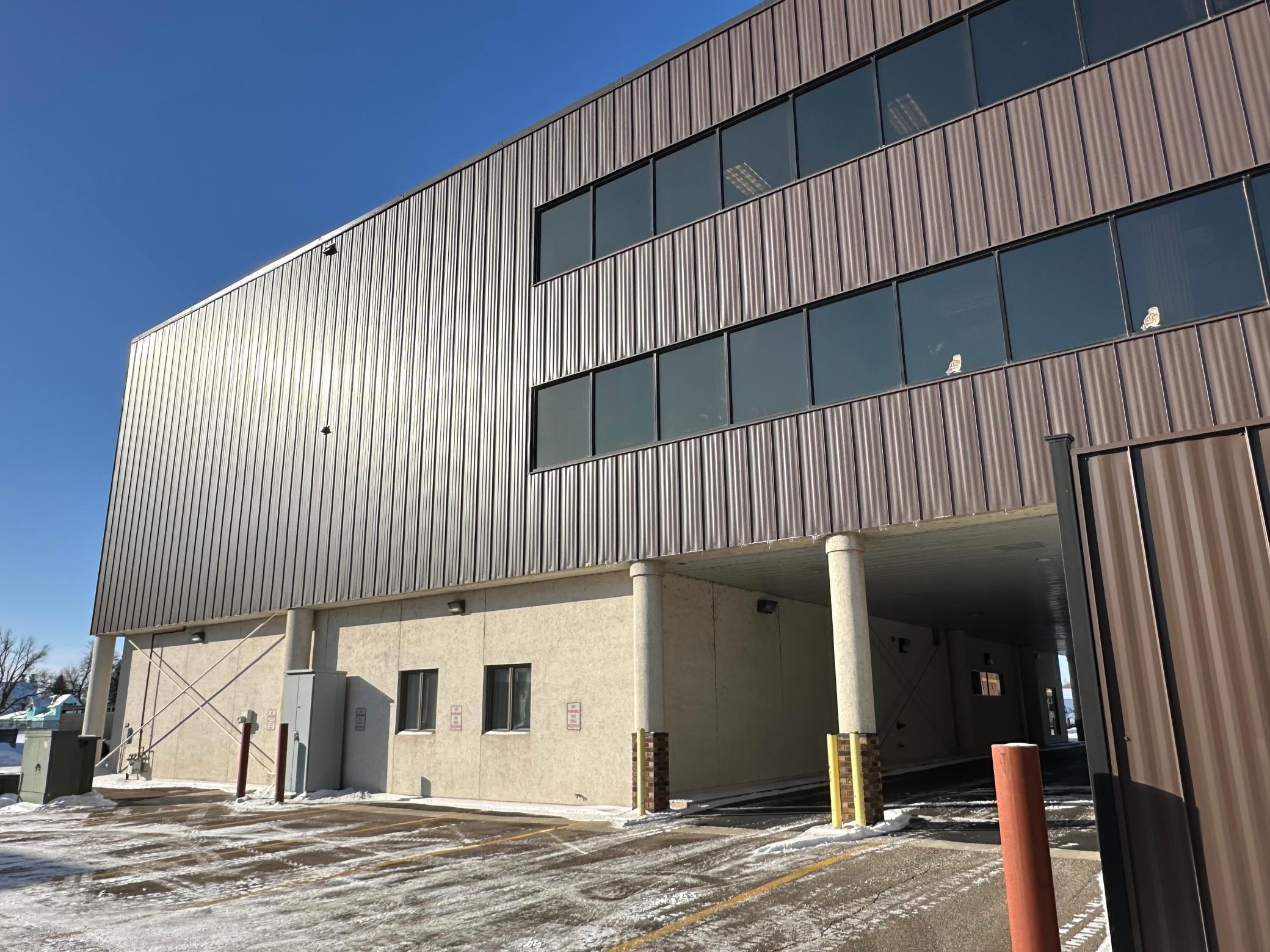 Rear of building with covered parking