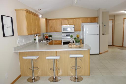 Open kitchen with plenty of counter space and cabinets.