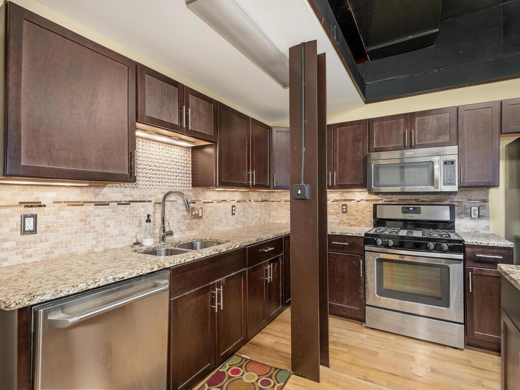 Common area kitchen with upgrades and complete with appliances.