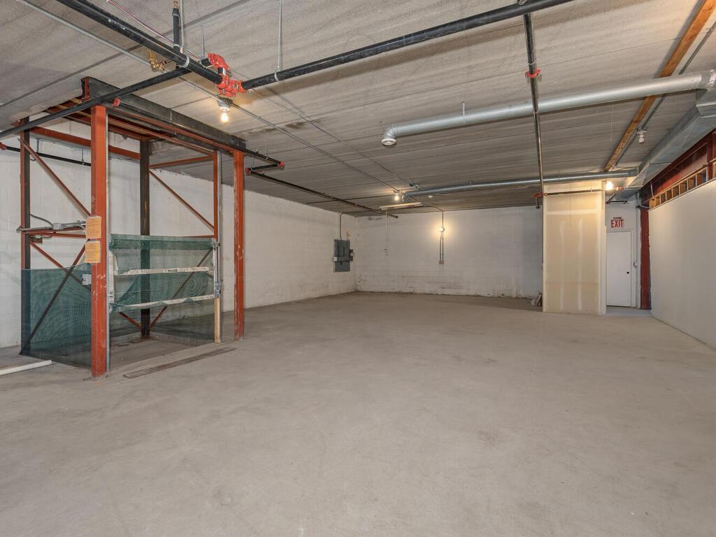 Freight elevator pictured at the lower level carries and moves product from lower to upper level dock area.