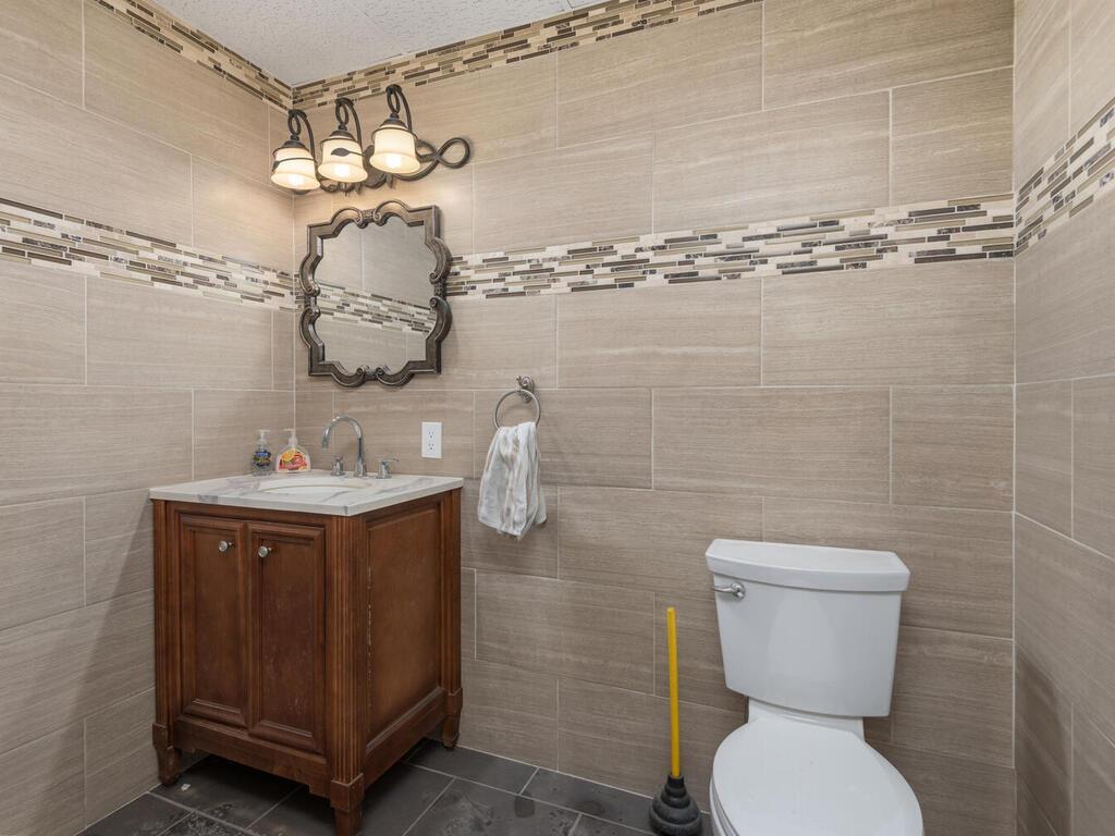Shared bathroom in the lower level warehouse area.