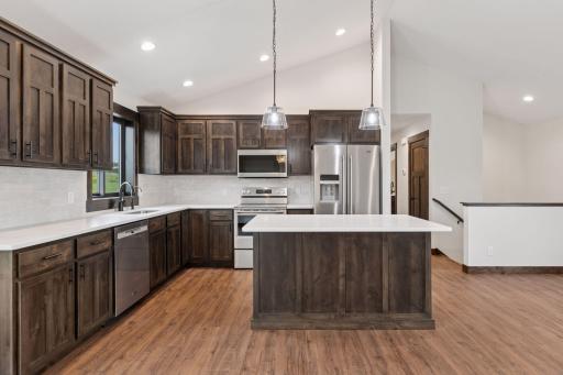 Photos are of a previously completed home with similar design and features. Actual selections, finishes, and materials may vary based on buyer choices and availability.