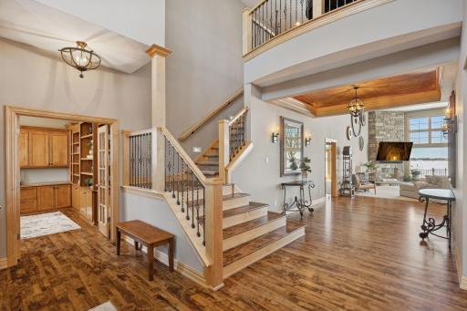 Elegant foyer with open sightlines, and a grand staircase that sets a welcoming tone