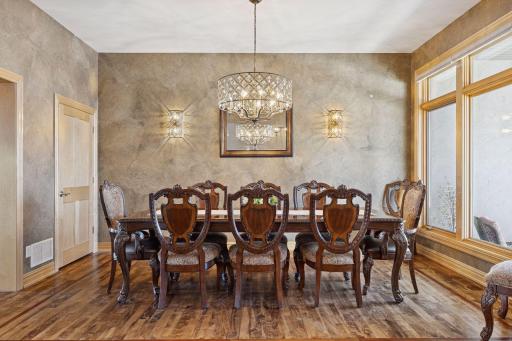 Elegant Formal Dining room with custom lighting