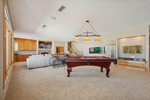 Spacious lower-level game room with ample natural lightâperfect for gatherings and recreation.