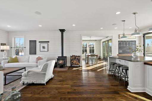 Living room off kitchen with a burning potbelly stove enough to warm the whole main floor.