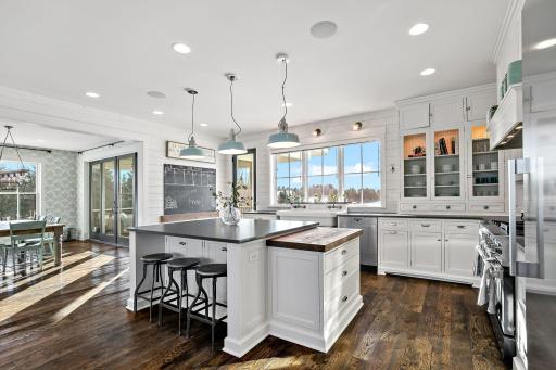 Kitchen door leads to backyard and trellis patio area.