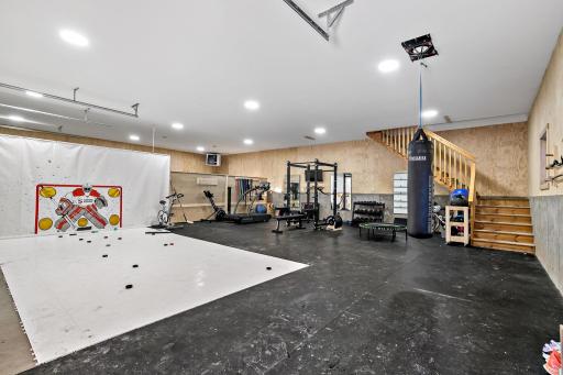 Inside the barn where main level used for hockey practice and workout room.