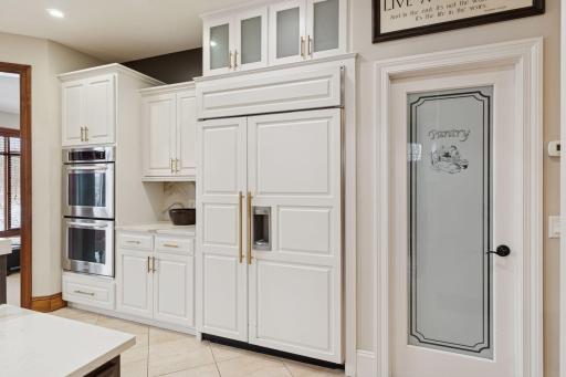 Kitchen features ample cabinet space and counter space for food prep