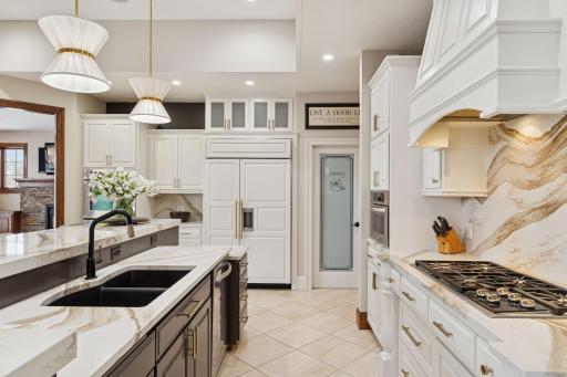 Elegant two-tone island with oversized sink, perfect for entertaining and everyday living