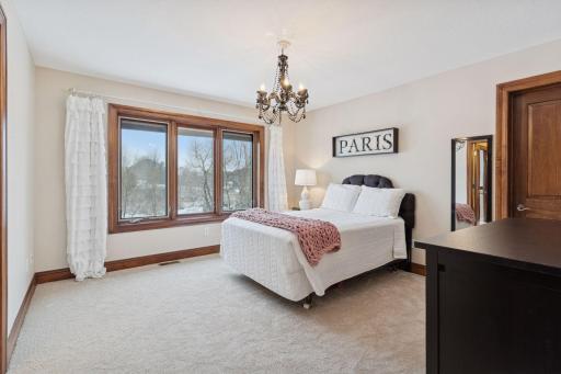 Third bedroom on the upper level with a walk-in closet and jack and jill full bathroom