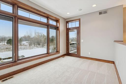 Primary Bedroom sitting area features a cozy gas fireplace - great spot for a reading nook or space to exercise.
