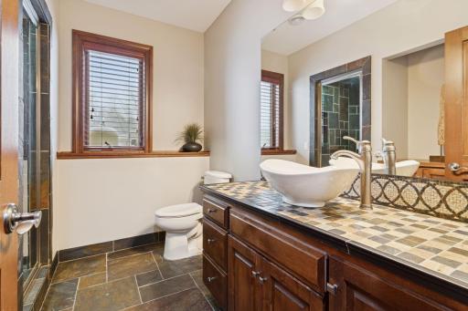 Lower level 3/4 bathroom with a steam shower