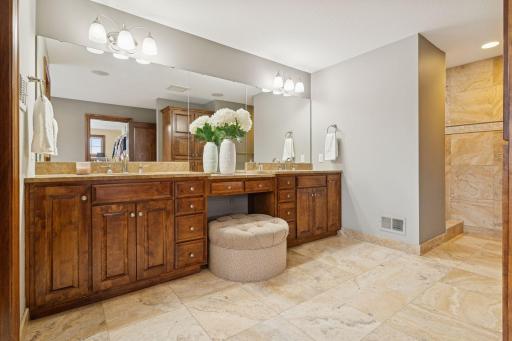 Features include walk-in shower, double sink, and lots of cabinet and counter space