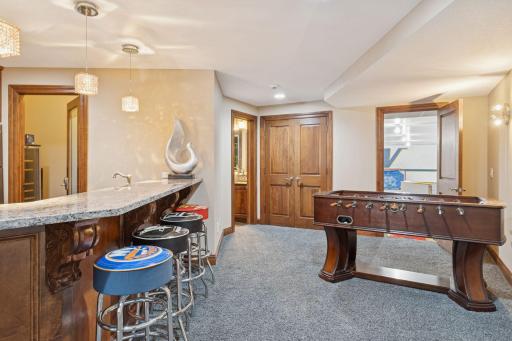 Another space for a game table is right off the wet bar