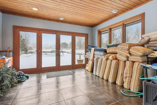 Sun room off the lower level Rec Room space - great for storing cushions or pool equipment