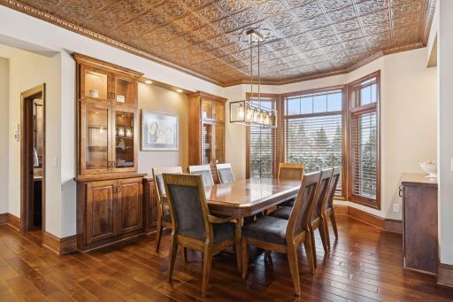 Formal Dining Room with built ins and striking ceiling details