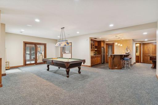 Lower level Rec Room with space or a pool table or hang out spot.