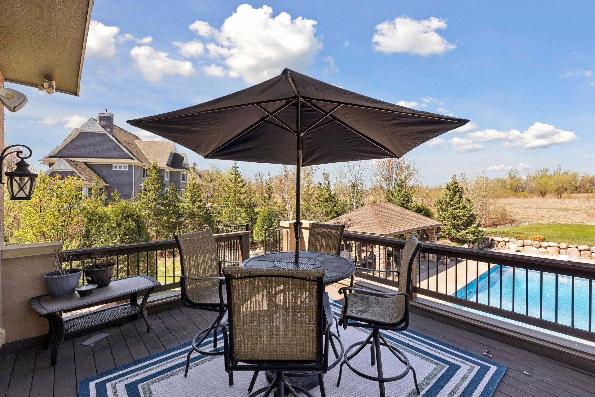 Upper balcony with views overlooking the pool and natural open space beyond