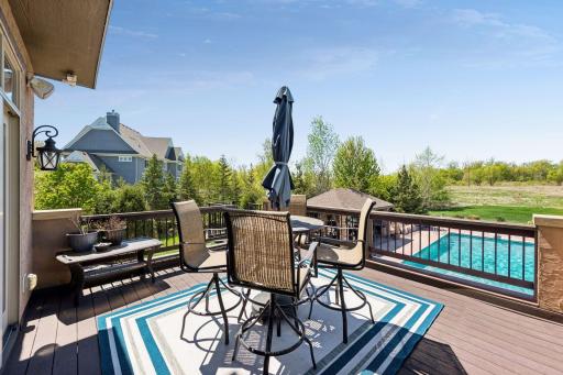 Upper balcony with views overlooking the pool and natural open space beyond