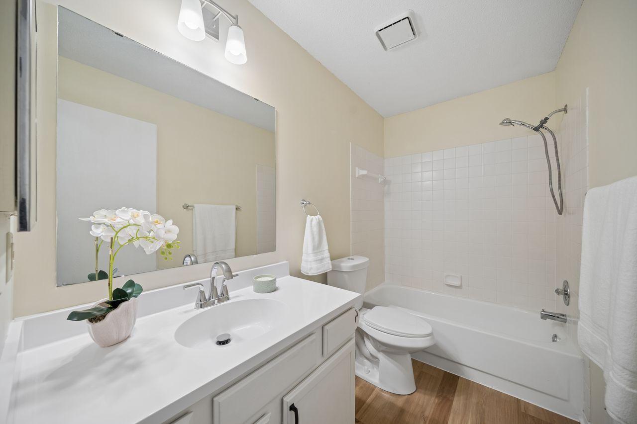 Second bath has also been updated with new vanity top, faucet, and light fixture,