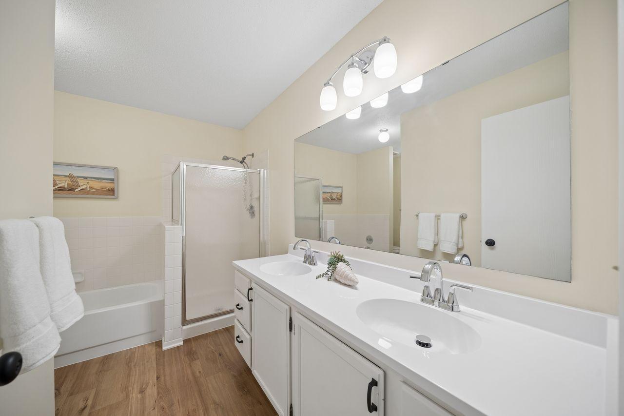 Large ensuite bath comes with a double sink with new top and faucets, and separate shower and a tub.