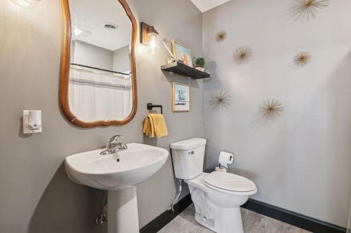 Finished lower-level Â¾ bath with walk-in shower.