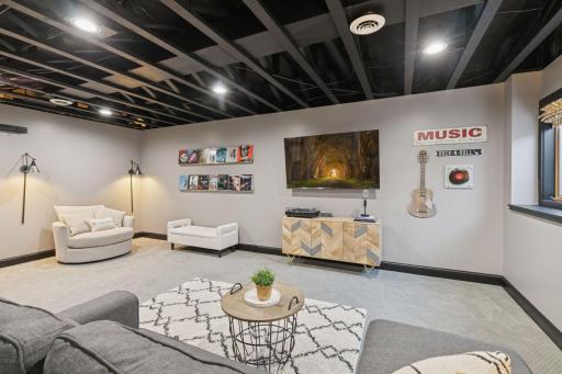 Recessed lighting and modern industrial-style ceiling.