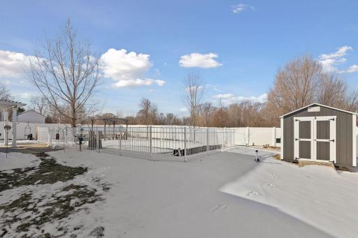 Double-fenced pool area for added safety and peace of mind. Shed added in 2025.