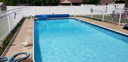 Heated in-ground pool surrounded by double-fenced pool area for added safety and peace of mind.