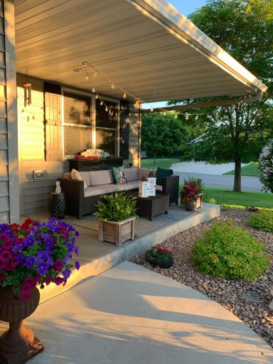 Covered front entry with space to sit and enjoy the neighborhood.