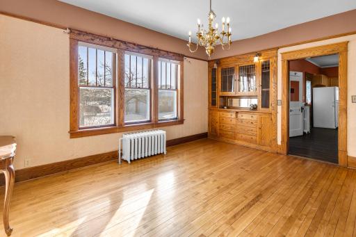 Formal dining with built in hutch, windows let in lots of natural sunlight